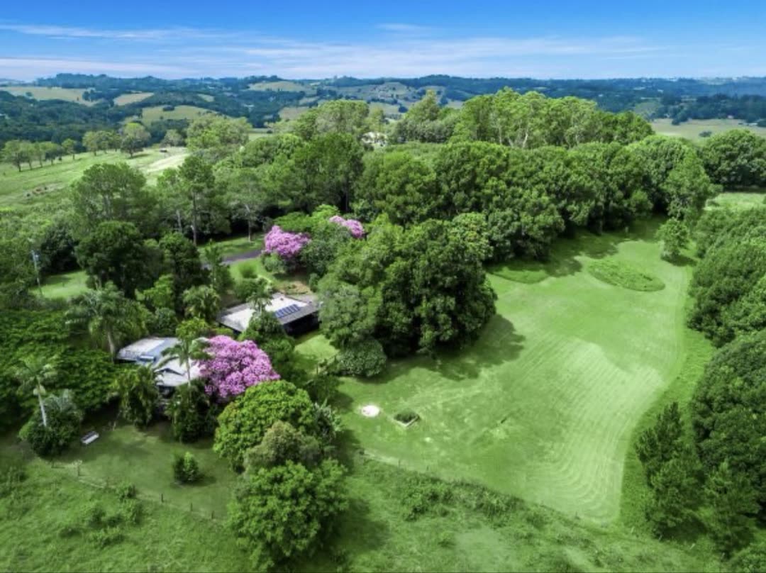 Aerial view of Gwandalan property with jacarandas in bloom and rolling hinterland